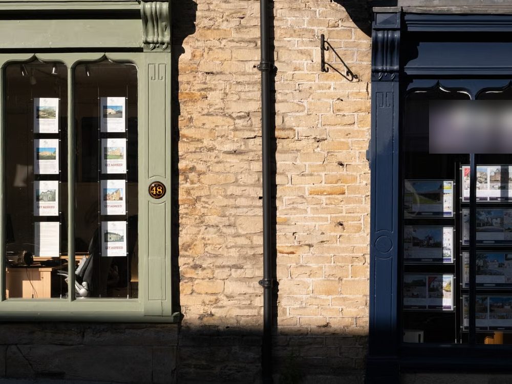 Estate agent windows showing sale agreed listings, the sold-price evidence behind a BMV claim