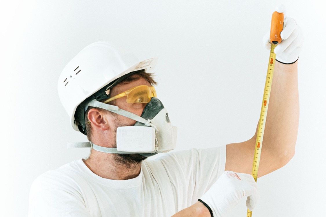 A tradesperson measuring during refurbishment works