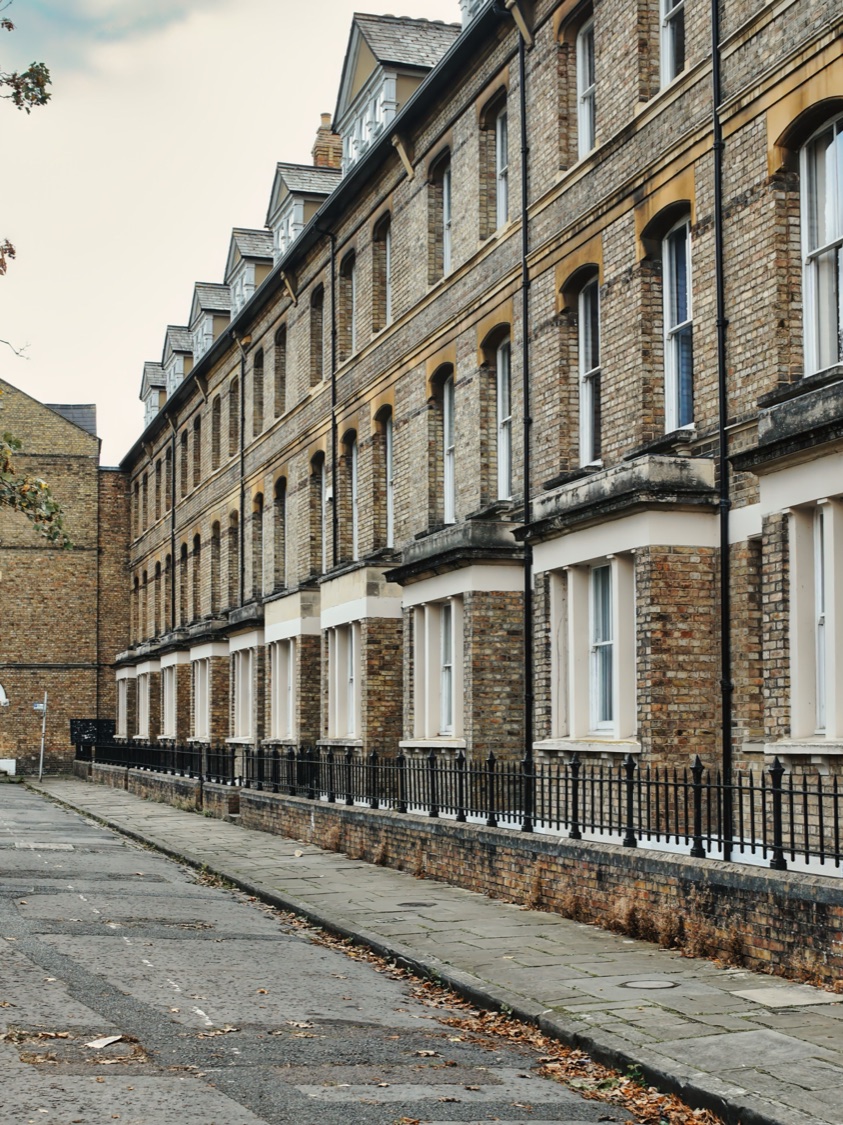 A row of Victorian terraced houses on a UK street