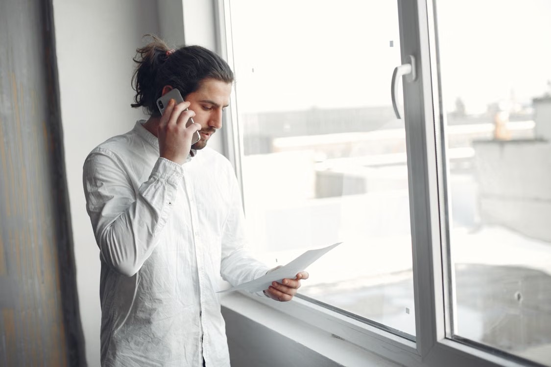 Reviewing tenancy documents during a phone call about a rented property