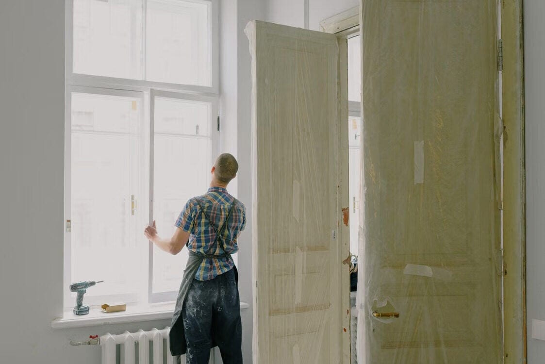 Construction workers renovating a house